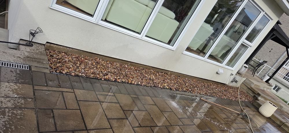 Interlock restoration and decorative river rock landscape bed